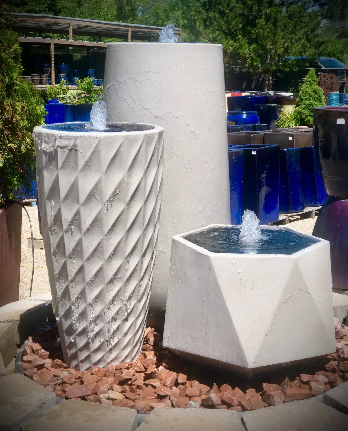 a three-pot fountain created with botanicals exclusive pottery
