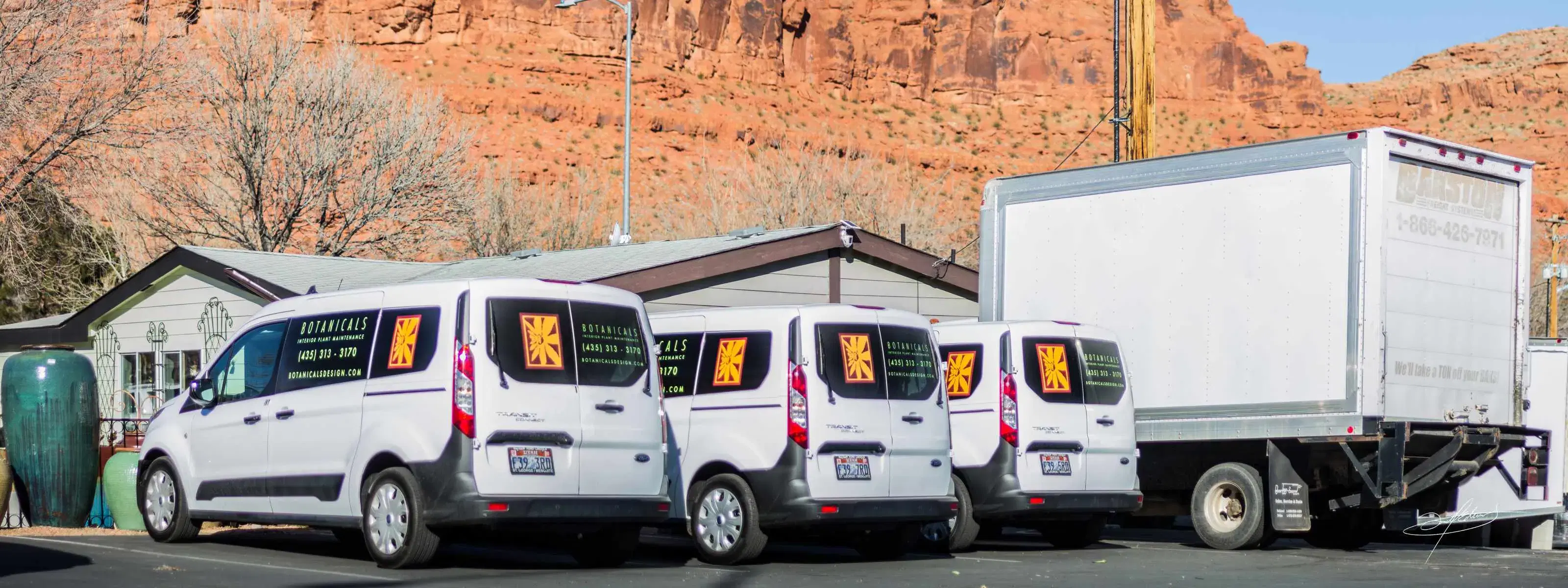 fleet of botanicals service transit vans parked in front of our st george retail location