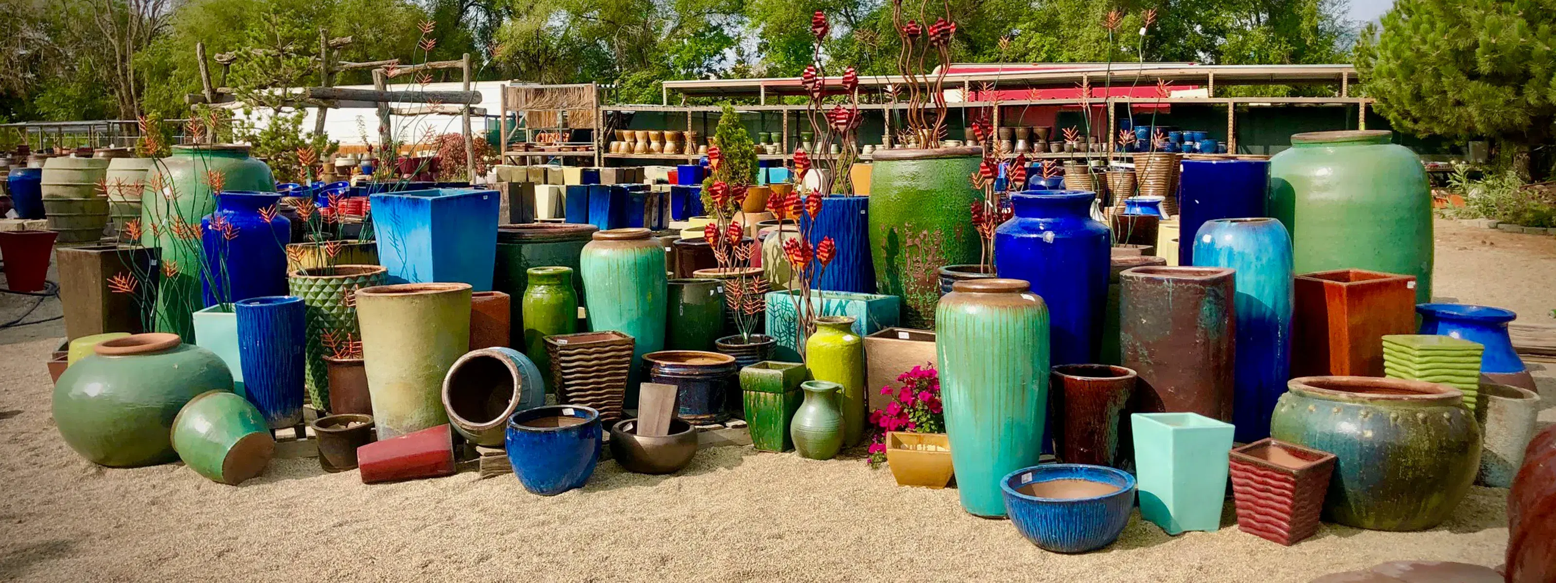a pottery display full of indoor and outdoor pottery on our sandy retail lot