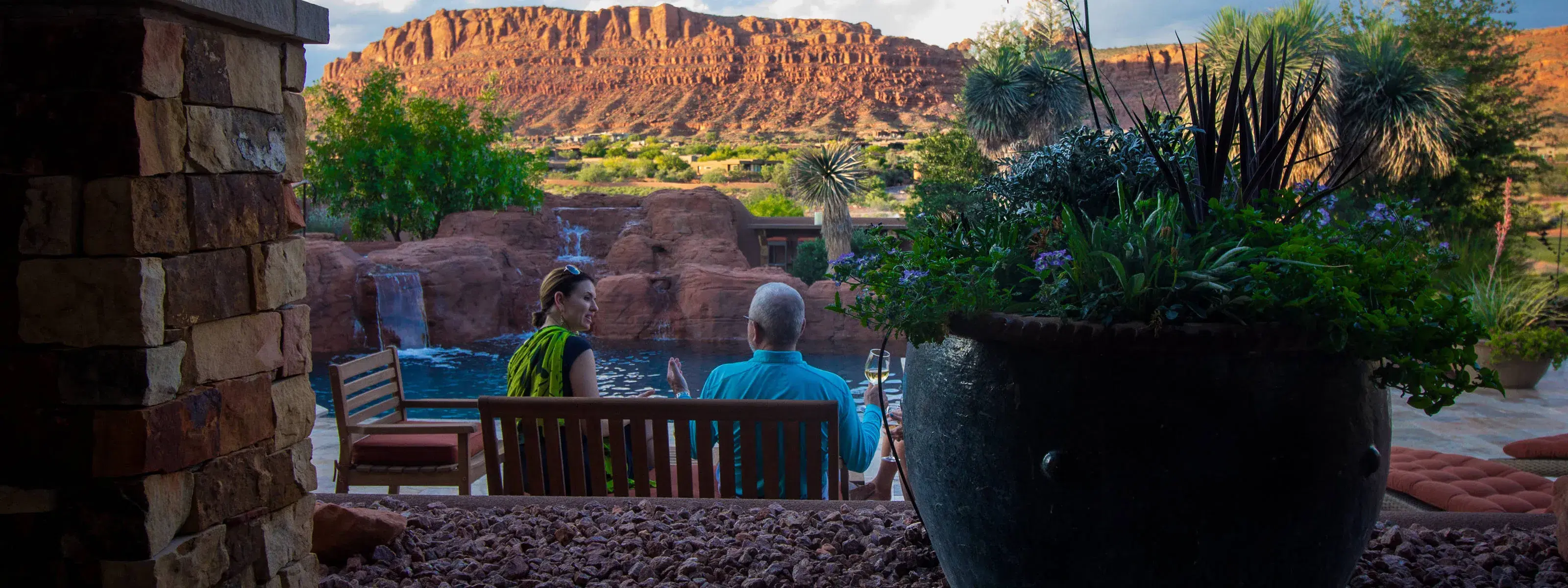 nicole hancock meeting with a client in a botanicals plantscaped yard in st george, utah