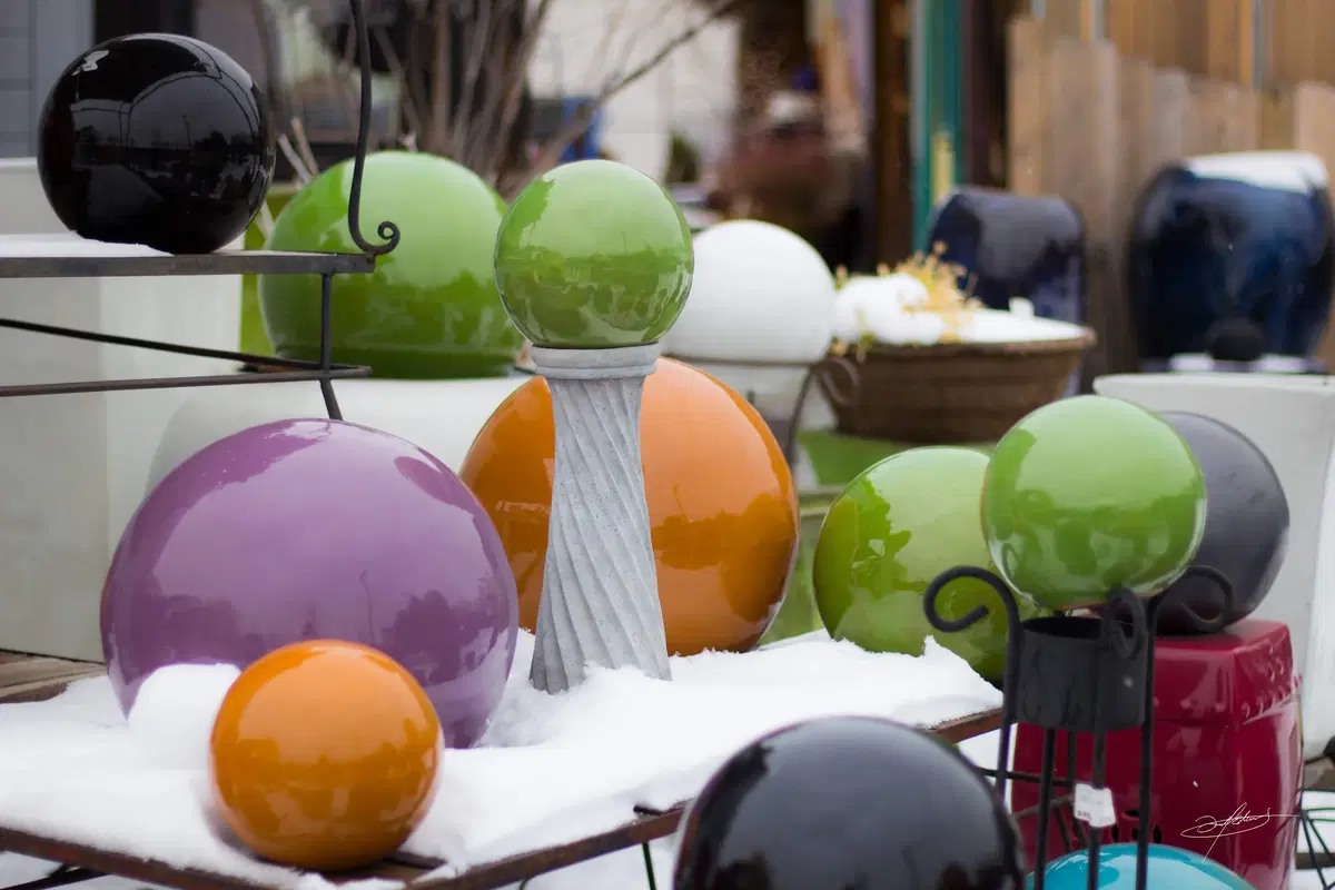 colorful ceramic globes in the snow
